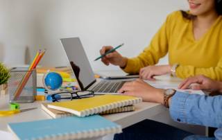 business casual adviser analyzing financial figures denoting progress internal revenue (1)