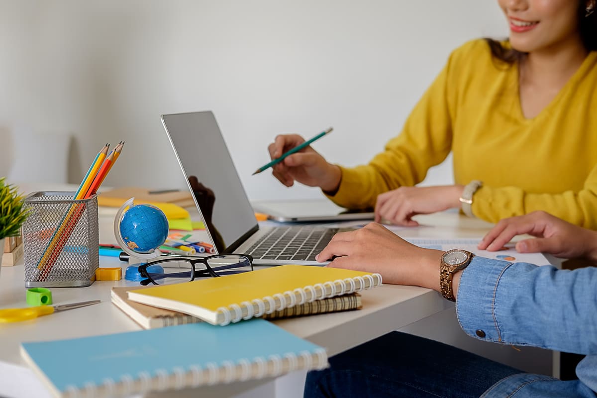 business casual adviser analyzing financial figures denoting progress internal revenue (1)